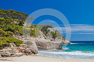 Cala Mitjana beach cliffs scenery