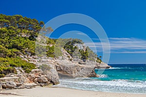 Cala Mitjana beach cliffs scenery photo