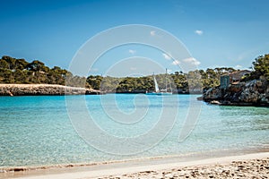 Cala S\'Amarador beach with white sand and turquoise sea in natural parkland Cala Mondrago bay at Majorca