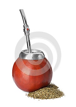 Calabash, bombilla and pile of mate tea on white background