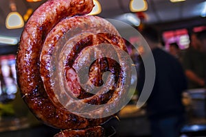 Calabrese sausage grill on skewers at a churrascaria steakhouse photo