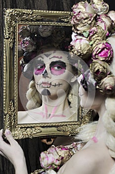 Calavera Catrina in the dark. Girl with sugar skull makeup. Dia de los muertos. Day of The Dead. Halloween