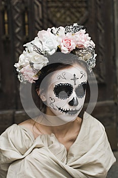 Calavera Catrina in the dark. Girl with sugar skull makeup. Dia de los muertos. Day of The Dead. Halloween