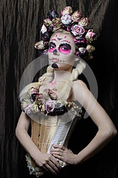 Calavera Catrina in the dark. Girll with sugar skull makeup. Dia de los muertos. Day of The Dead. Halloween