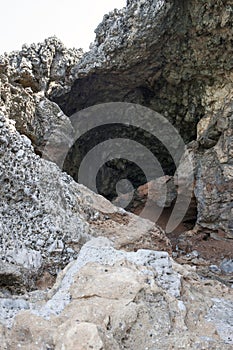 A calcareous cave on the beach. photo