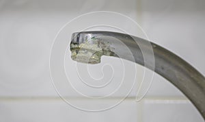 Calcification of a faucet in closeup