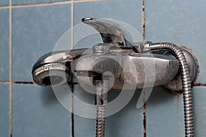 Calcified faucet and shower head.