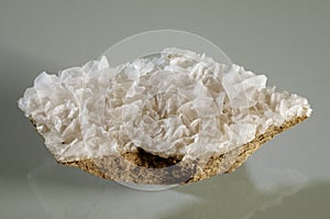 Calcite white crystal formation over a rock substrate