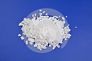 Calcium chloride on blue background