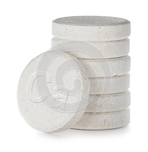 Calcium supplement. Stack of tablets on white background, closeup
