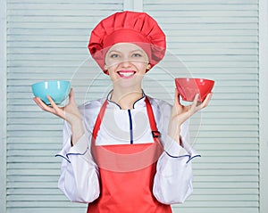 Calculate normal portion of food. Calculate your food servings size. Diet and dieting concept. Woman cook hold bowls