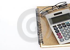 Calculater and glasses with book notes on white backgrounds