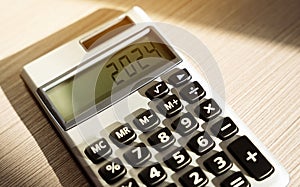 Calculator 2024 close-up. Finance and business concept. Investments and investing money.