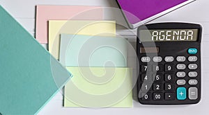 Calculator with agenda text, plus colored notepads and stickers