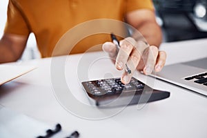 Calculator, budget and man hands with finance, profit check and financial accounting on office desk closeup. Person or