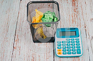 Calculator with crumple paper on the table for business and copy space