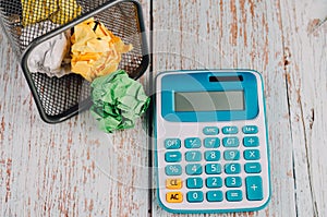 Calculator with crumple paper on the table for business and copy space