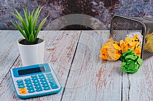 Calculator with crumple paper on the table for business and copy space