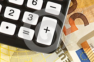 A calculator and euro bills