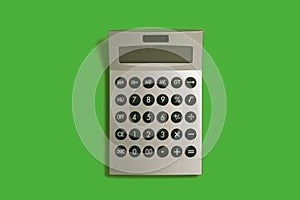 calculator on a green surface. school and office accessories