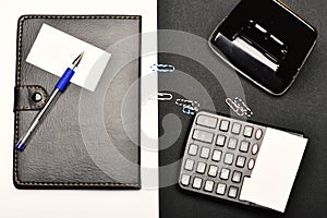 Calculator, hole punch and organizer as work and business concept