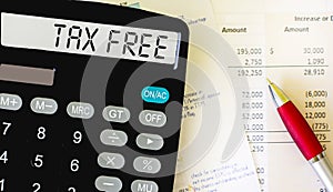 Calculator labeled TAX FREE. Manual calculation of tax-free percentage for services or products