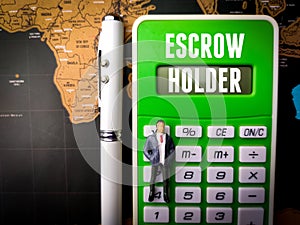 Calculator,miniature people and pen with text ESCROW HOLDER