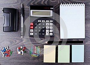The calculator, notebook, leaflets for record and stationery