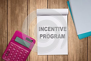 Calculator and notes with incentive program text