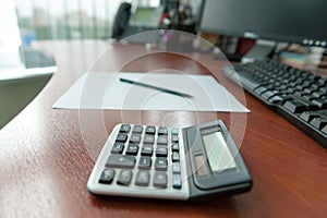 Calculator on office descktop photo
