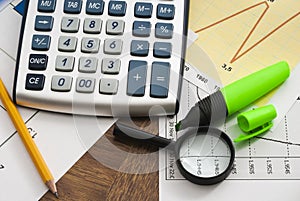 Calculator on paper table with diagram