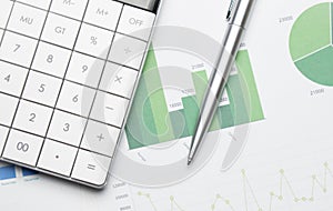 Calculator with pen on financial data. Business and financial research concept