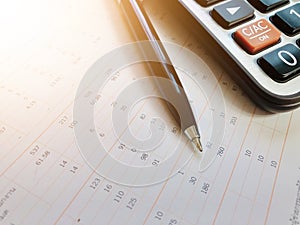 Calculator and pen on financial statements