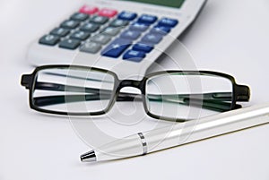 Calculator pen and glasses