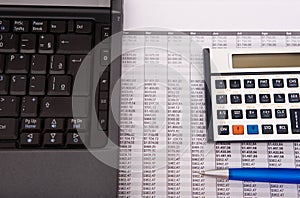 Calculator, pen and notebook