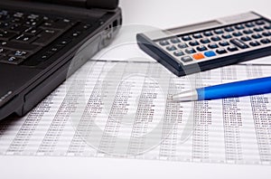 Calculator, pen and notebook