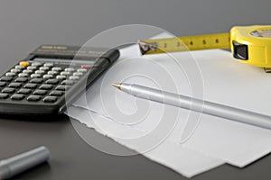 Calculator pencil and meter tape