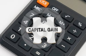 On the calculator is a puzzle with the inscription - capital gain