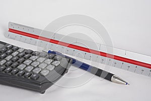 Calculator, scale and pencil