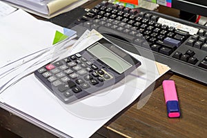 Calculator, staple and business documents stack