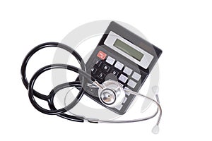 Calculator with stethoscope over white