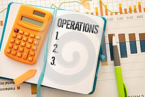 Calculator and sticky note with the number 123 on a red background.