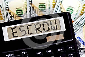 Calculator with text ESCROW on the dollars. Business, finance conceptual