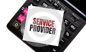 Calculator with text SERVICE PROVIDER with white paper