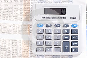 Calculator on top of newspaper