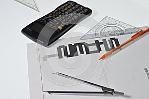 Calculator on a white background, triangular ruler, Crayola