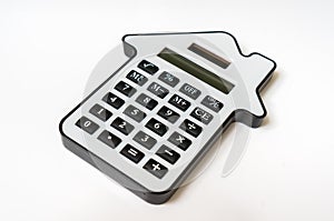 Calculator on white - real estate, lease and mortgage concept