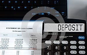 Calculator with the word Deposit on the display