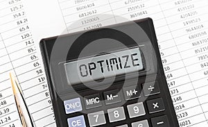 Calculator with the word OPTIMIZE on the display