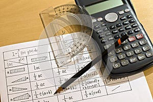 Calculators, pen, protractor and tables